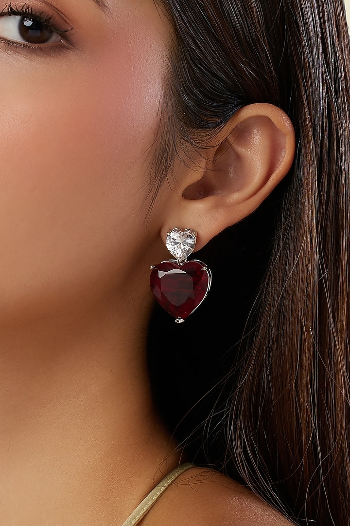 White Rhodium Finish Ruby Gemstone Stud Earrings by Isharya at Pernia's Pop Up Shop
