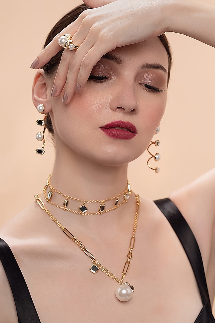 Gold Plated Shell Pearl Dangler Earrings by Isharya