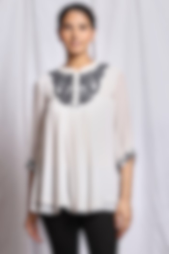 White Hand Embroidered Flared Top by Isha Singhal at Pernia's Pop Up Shop