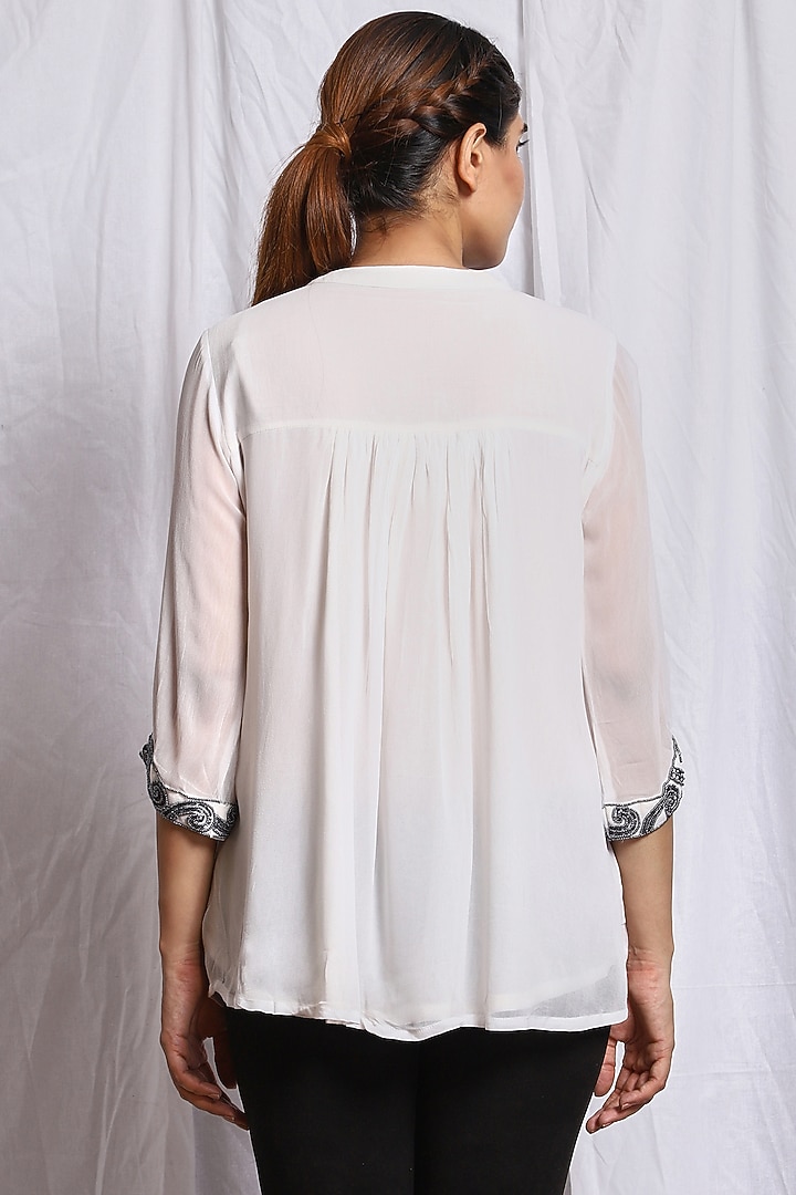 White Hand Embroidered Flared Top by Isha Singhal at Pernia's Pop Up Shop