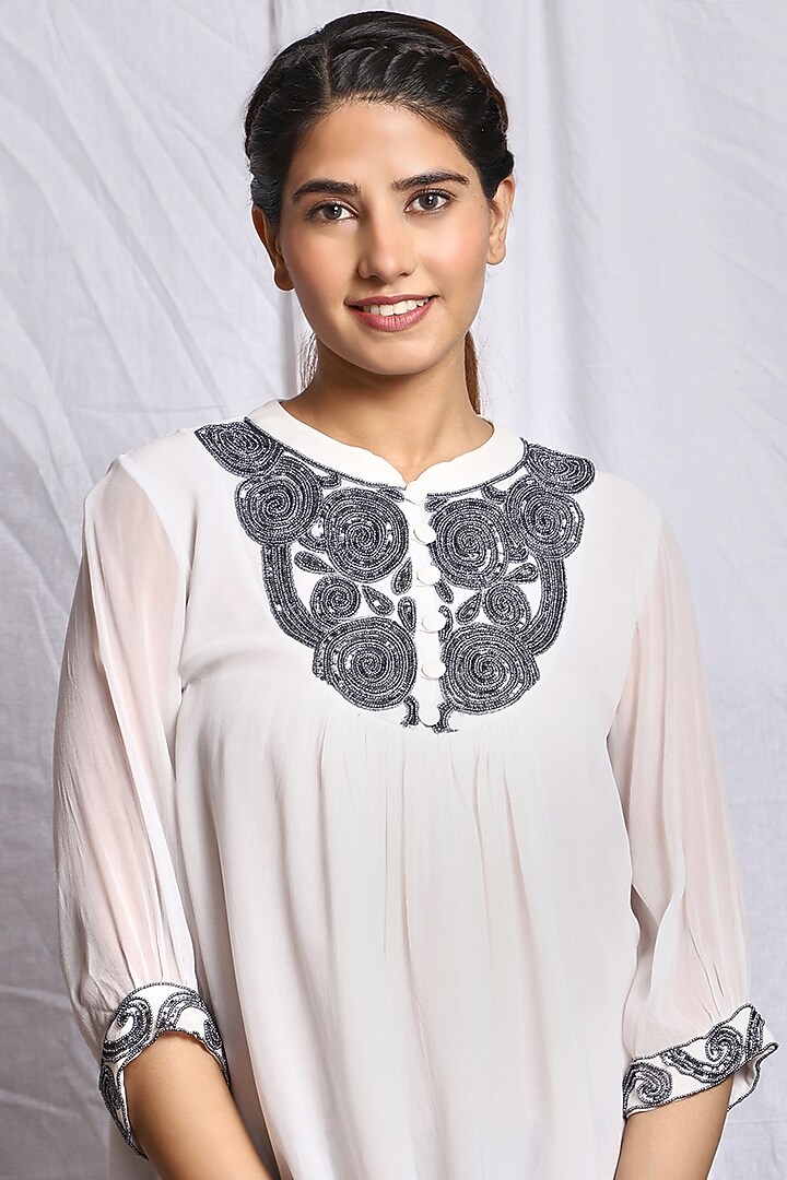 White Hand Embroidered Flared Top by Isha Singhal at Pernia's Pop Up Shop