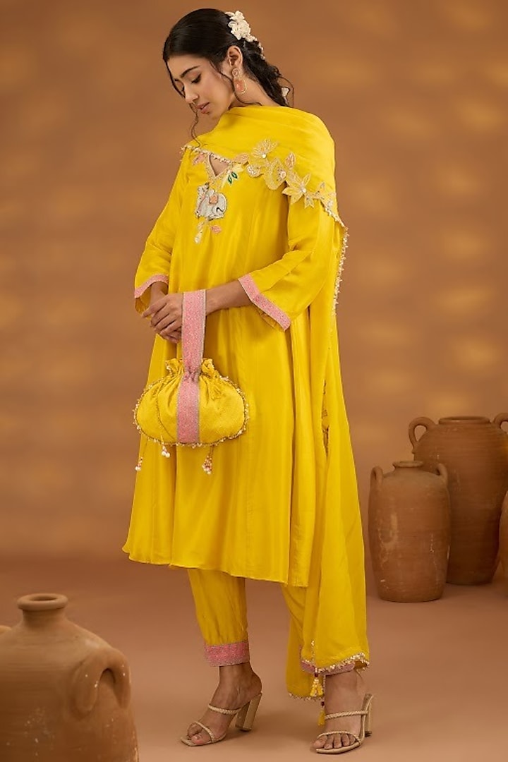 Yellow Silk Embellished Potli by Isha Gupta Tayal at Pernia's Pop Up Shop