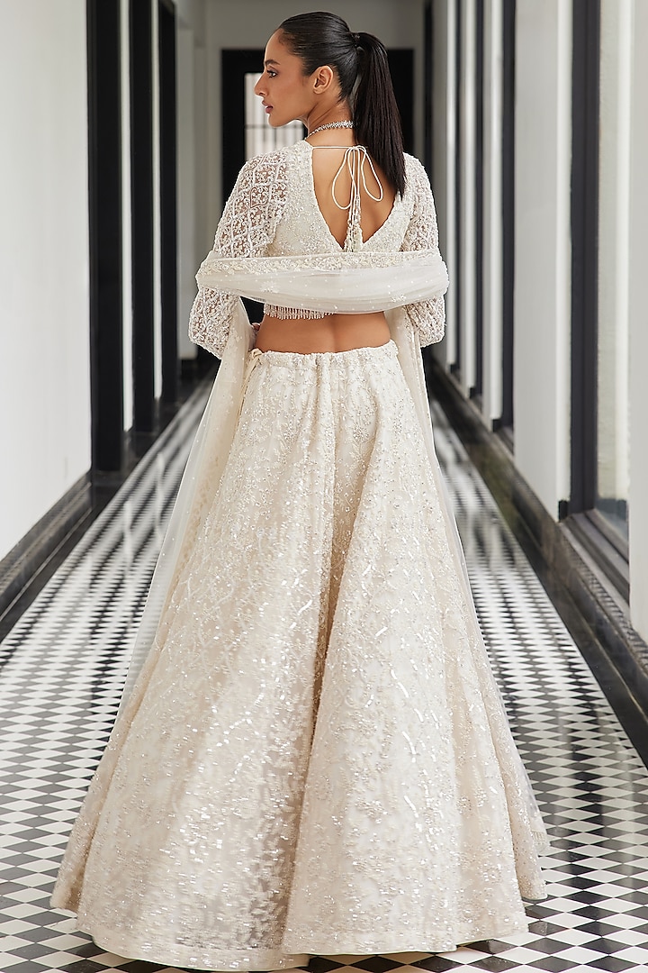 Ivory Net Hand Embroidered Bridal Lehenga Set by ISTYA at Pernia's Pop Up Shop