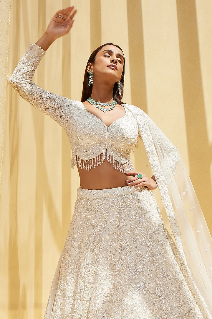 Ivory Net Sequin & Cutdana Embellished Bridal Lehenga Set by ISTYA at Pernia's Pop Up Shop