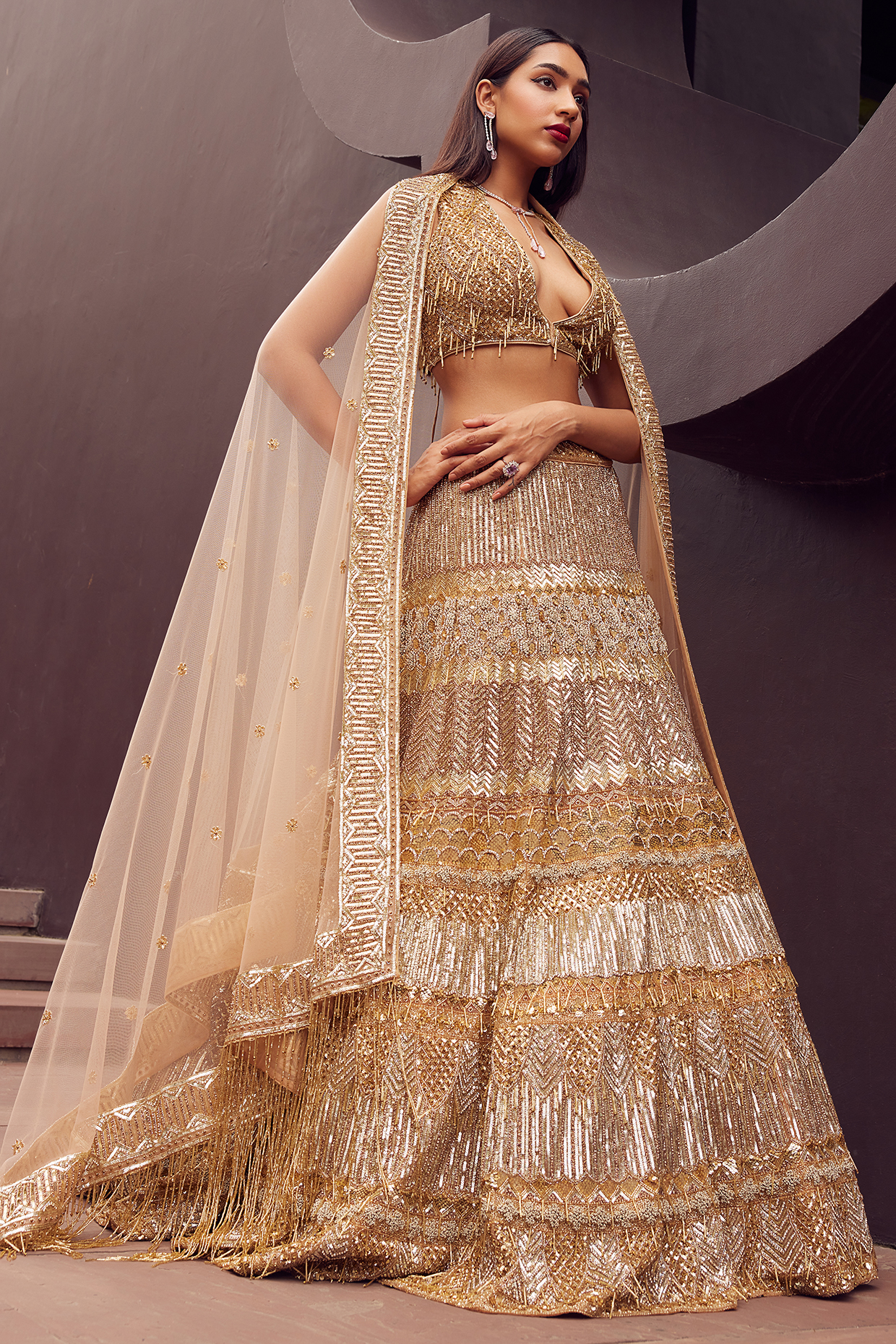 Gold Net Sequin & Cutdana Hand Embellished Bridal Lehenga Set by ISTYA at Pernia's Pop Up Shop