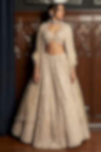 Beige Net Applique Embroidered Bridal Lehenga Set by ISTYA at Pernia's Pop Up Shop