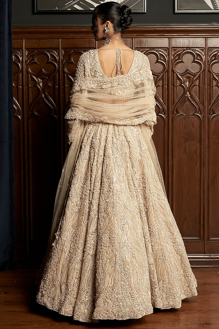 Beige Net Applique Embroidered Bridal Lehenga Set by ISTYA at Pernia's Pop Up Shop