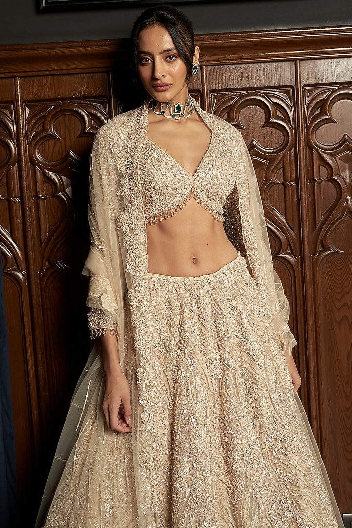 Beige Net Applique Embroidered Bridal Lehenga Set by ISTYA at Pernia's Pop Up Shop