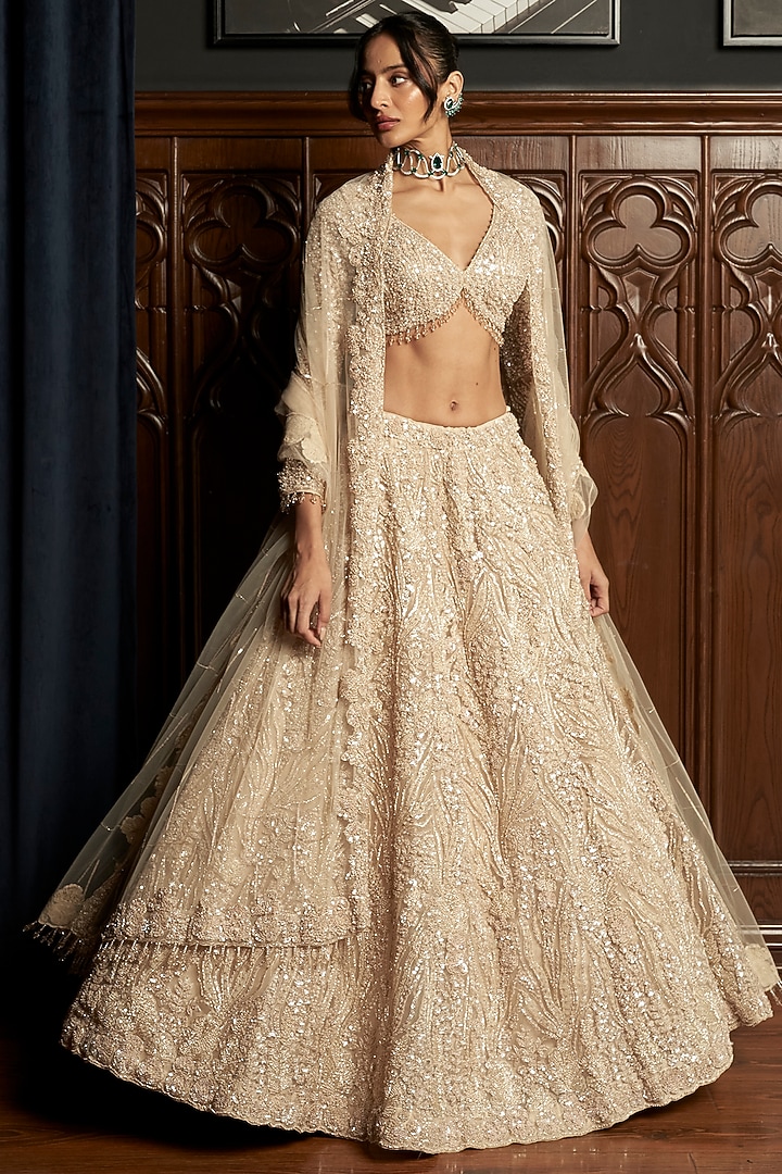 Beige Net Applique Embroidered Bridal Lehenga Set by ISTYA at Pernia's Pop Up Shop