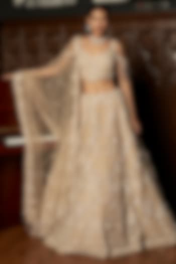 Beige Net Hand Embellished Bridal Lehenga Set by ISTYA at Pernia's Pop Up Shop