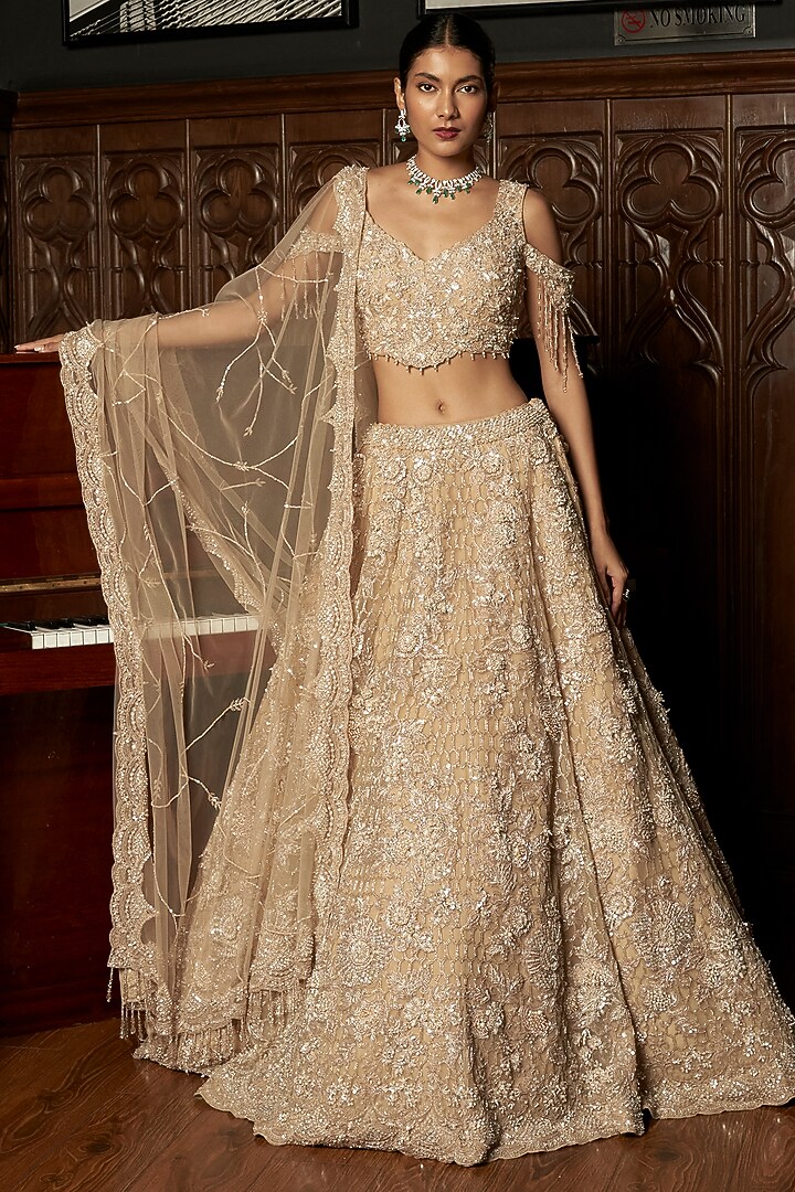 Beige Net Hand Embellished Bridal Lehenga Set by ISTYA at Pernia's Pop Up Shop