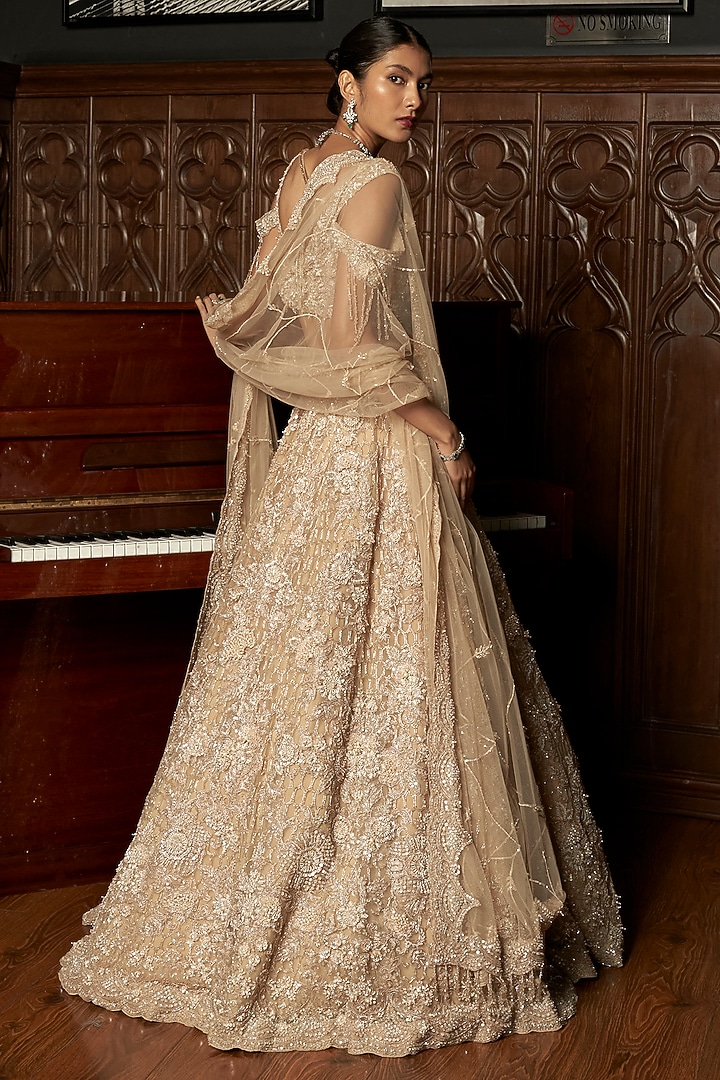 Beige Net Hand Embellished Bridal Lehenga Set by ISTYA at Pernia's Pop Up Shop