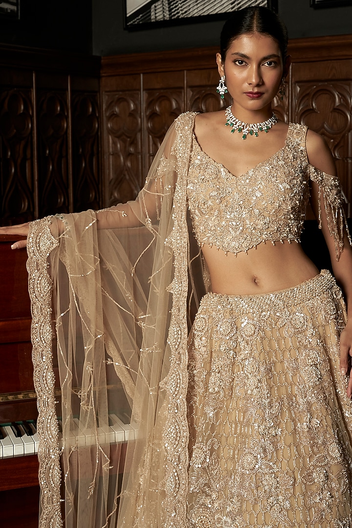 Beige Net Hand Embellished Bridal Lehenga Set by ISTYA at Pernia's Pop Up Shop