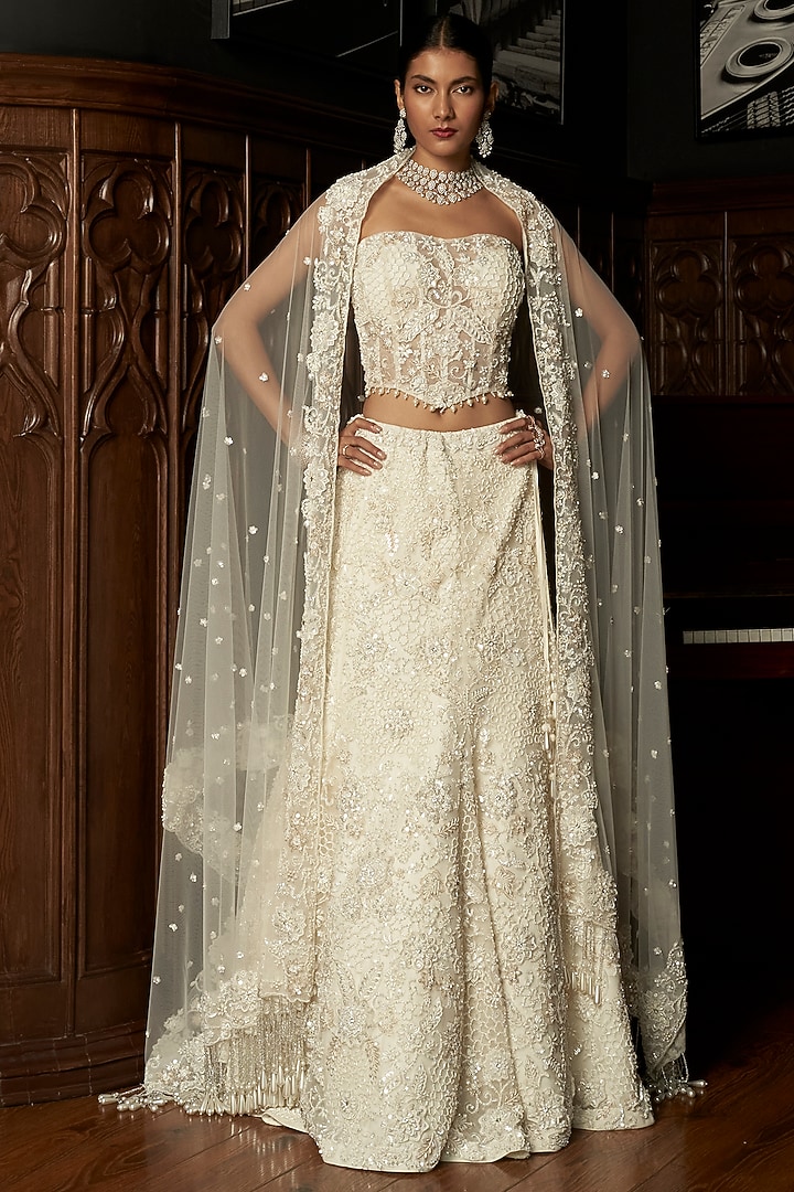 Ivory Net Hand Embroidered Bridal Lehenga Set by ISTYA at Pernia's Pop Up Shop