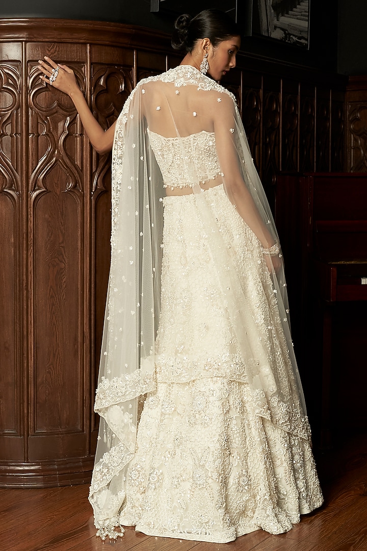 Ivory Net Hand Embroidered Bridal Lehenga Set by ISTYA at Pernia's Pop Up Shop