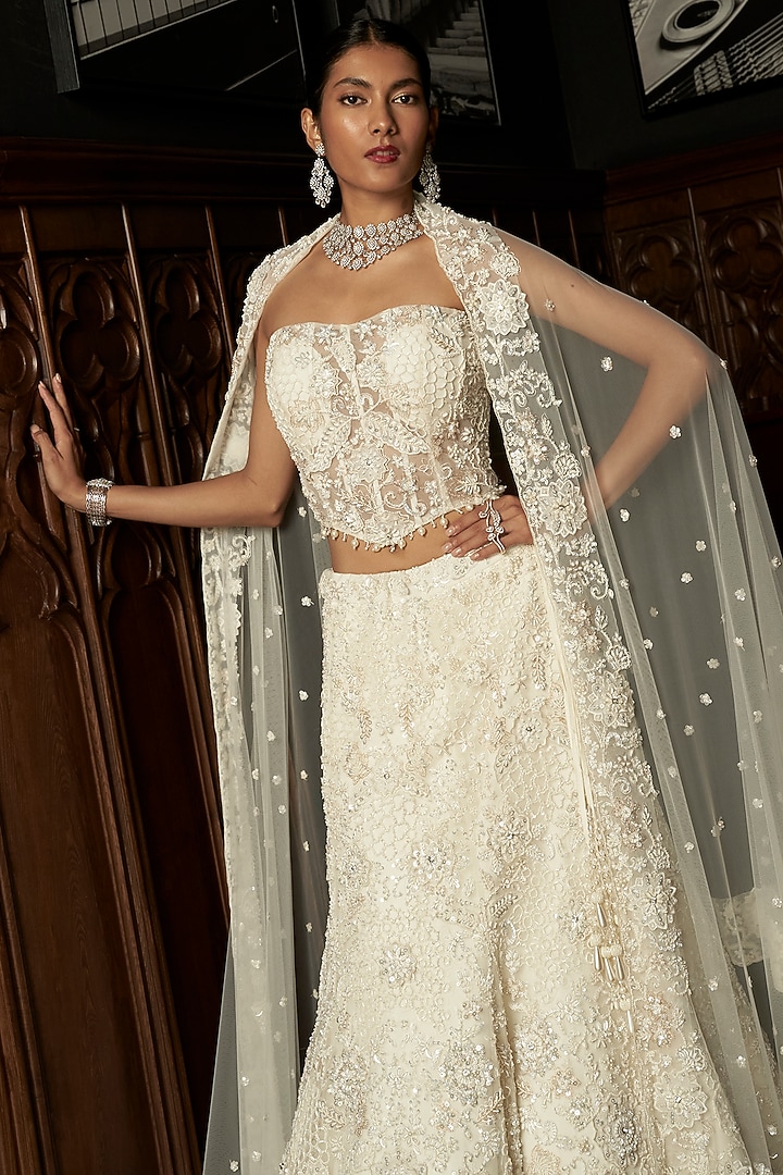 Ivory Net Hand Embroidered Bridal Lehenga Set by ISTYA at Pernia's Pop Up Shop