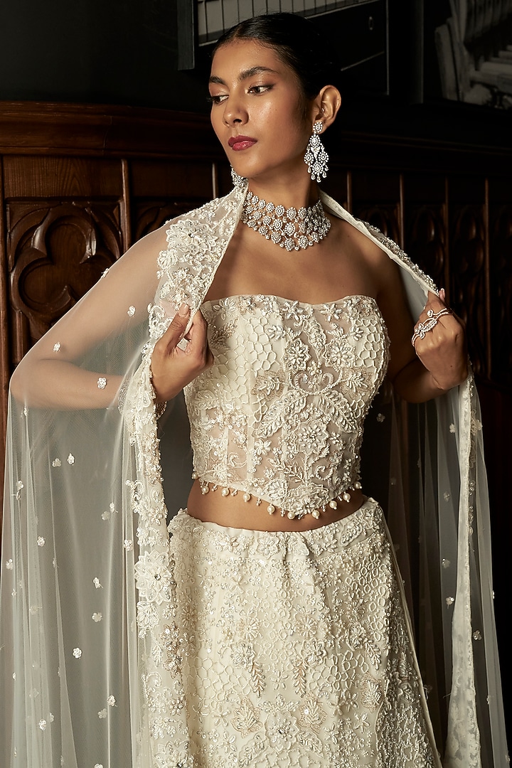 Ivory Net Hand Embroidered Bridal Lehenga Set by ISTYA at Pernia's Pop Up Shop