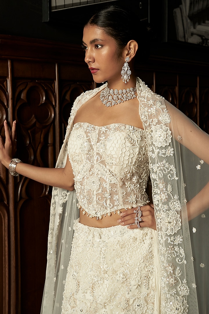 Ivory Net Hand Embroidered Bridal Lehenga Set by ISTYA at Pernia's Pop Up Shop
