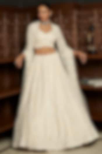 Ivory Net Applique Embellished Bridal Lehenga Set by ISTYA at Pernia's Pop Up Shop