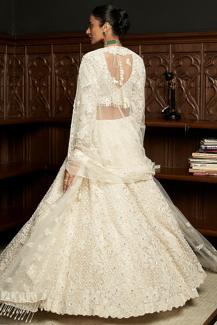 Ivory Net Applique Embellished Bridal Lehenga Set by ISTYA at Pernia's Pop Up Shop