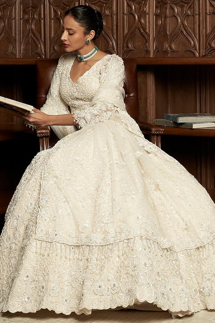 Ivory Net Applique Embellished Bridal Lehenga Set by ISTYA at Pernia's Pop Up Shop