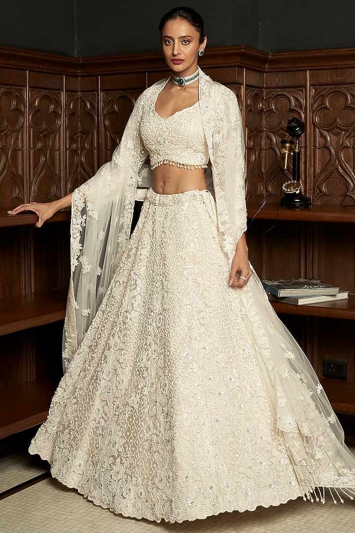 Ivory Net Applique Embellished Bridal Lehenga Set by ISTYA at Pernia's Pop Up Shop