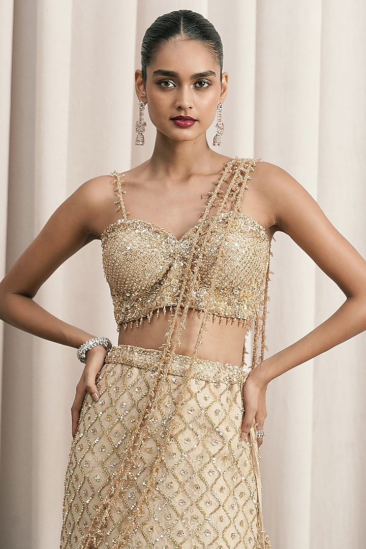 Beige Net Sequin Hand Embroidered Fish-Cut Bridal Lehenga Set by ISTYA at Pernia's Pop Up Shop