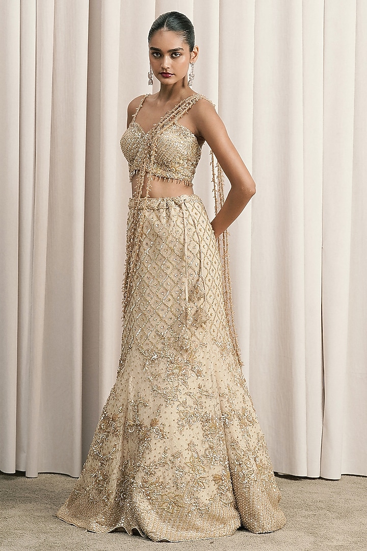 Beige Net Sequin Hand Embroidered Fish-Cut Bridal Lehenga Set by ISTYA at Pernia's Pop Up Shop