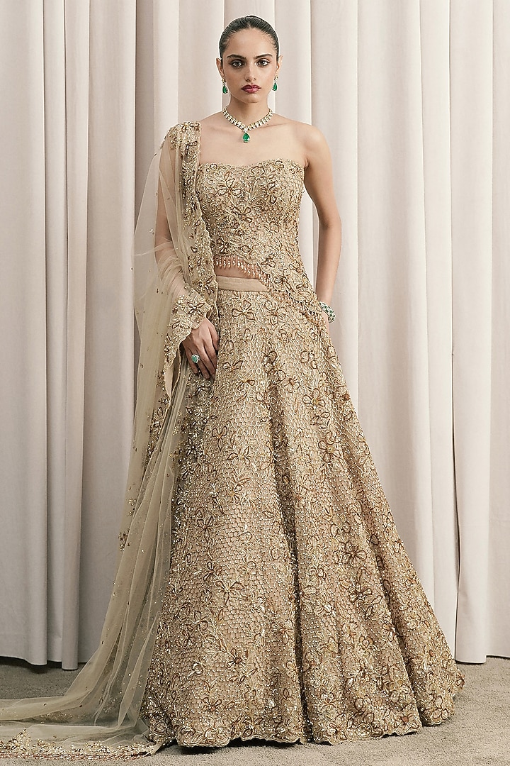 Beige Net Cutdana Hand Embroidered Fish-Cut Bridal Lehenga Set by ISTYA at Pernia's Pop Up Shop
