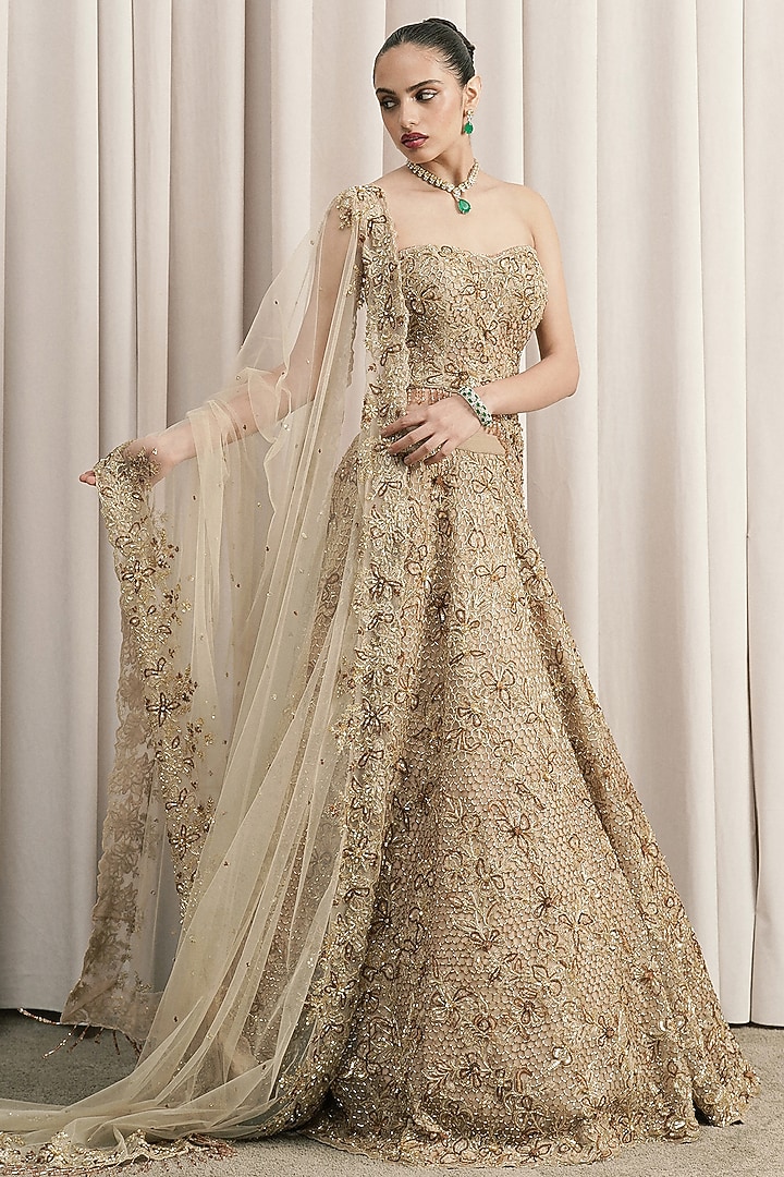 Beige Net Cutdana Hand Embroidered Fish-Cut Bridal Lehenga Set by ISTYA at Pernia's Pop Up Shop