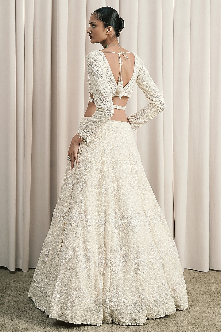 Ivory Net Sequin & Cutdana Embellished Bridal Lehenga Set by ISTYA at Pernia's Pop Up Shop