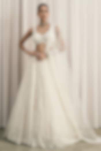 Ivory Net Sequin Embellished Bridal Lehenga Set by ISTYA at Pernia's Pop Up Shop