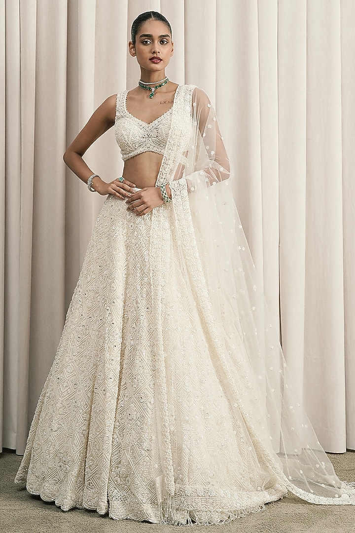 Ivory Net Sequin Embellished Bridal Lehenga Set by ISTYA at Pernia's Pop Up Shop