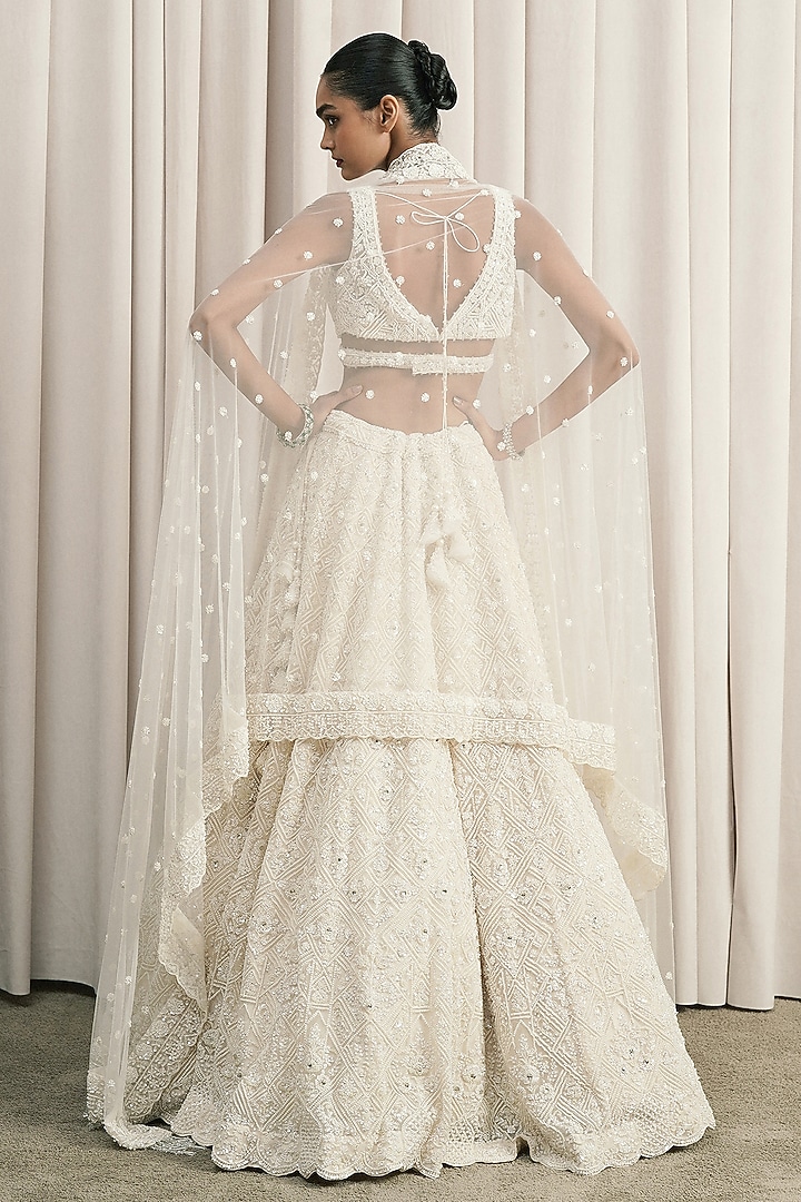 Ivory Net Sequin Embellished Bridal Lehenga Set by ISTYA at Pernia's Pop Up Shop