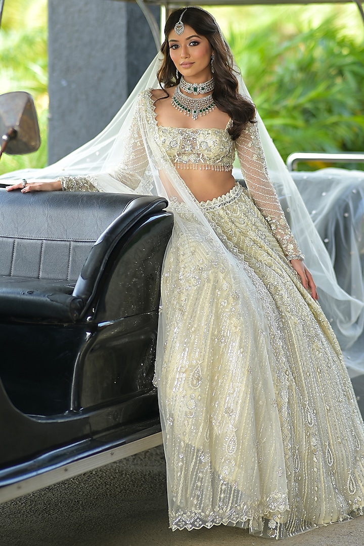 Ivory Net Embroidered Lehenga Set by Isa by Dolly Wahal