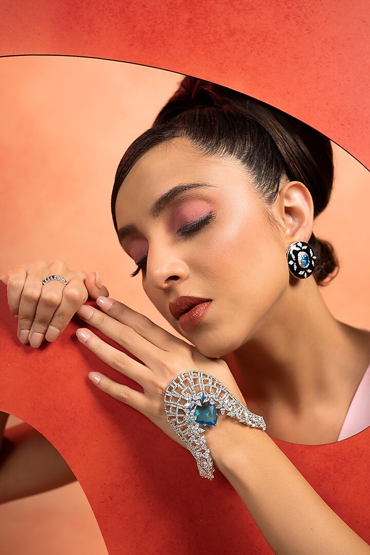 White Finish Synthetic Sapphire Stone Hand Wrap Cocktail Bracelet In Sterling Silver by ITEE Jewellery at Pernia's Pop Up Shop