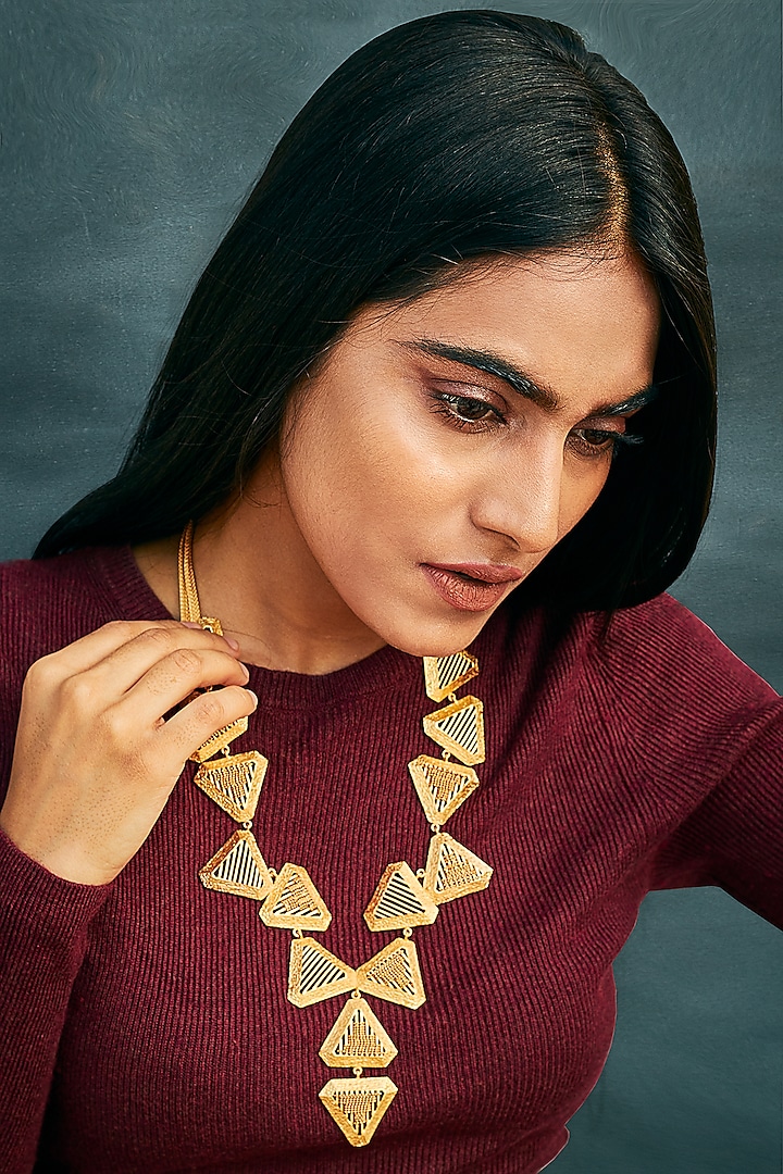 Yellow Gold Finish Long Triangle Necklace by Itrana By Sonal Gupta
