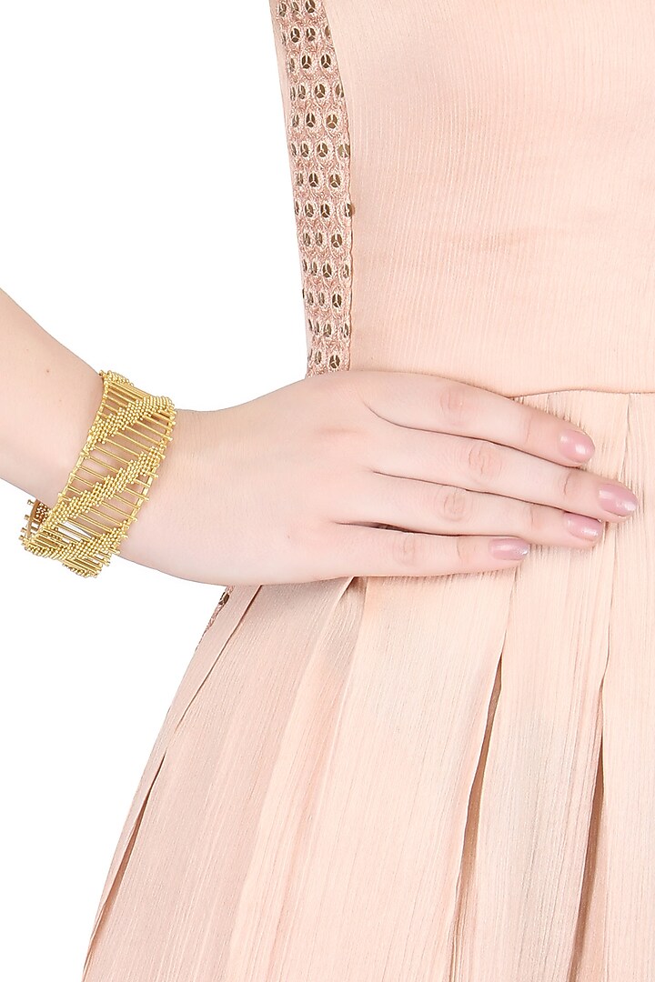 Itrana by Sonal Gupta presents Dull gold finish adjustable horizontal striped cuff bracelet available only at Pernia's Pop Up Shop.