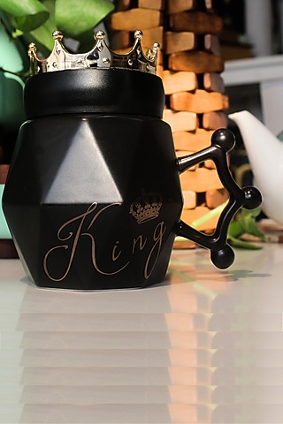 Black Ceramic Mug by IZZHAAR