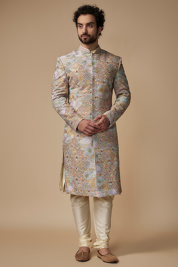 Gold Raw Silk Embroidered Sherwani Set by Jayesh and Kaajal Shah