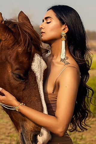 Gold Finish Pearl Dangler Earrings by Jewellery by Astha Jagwani