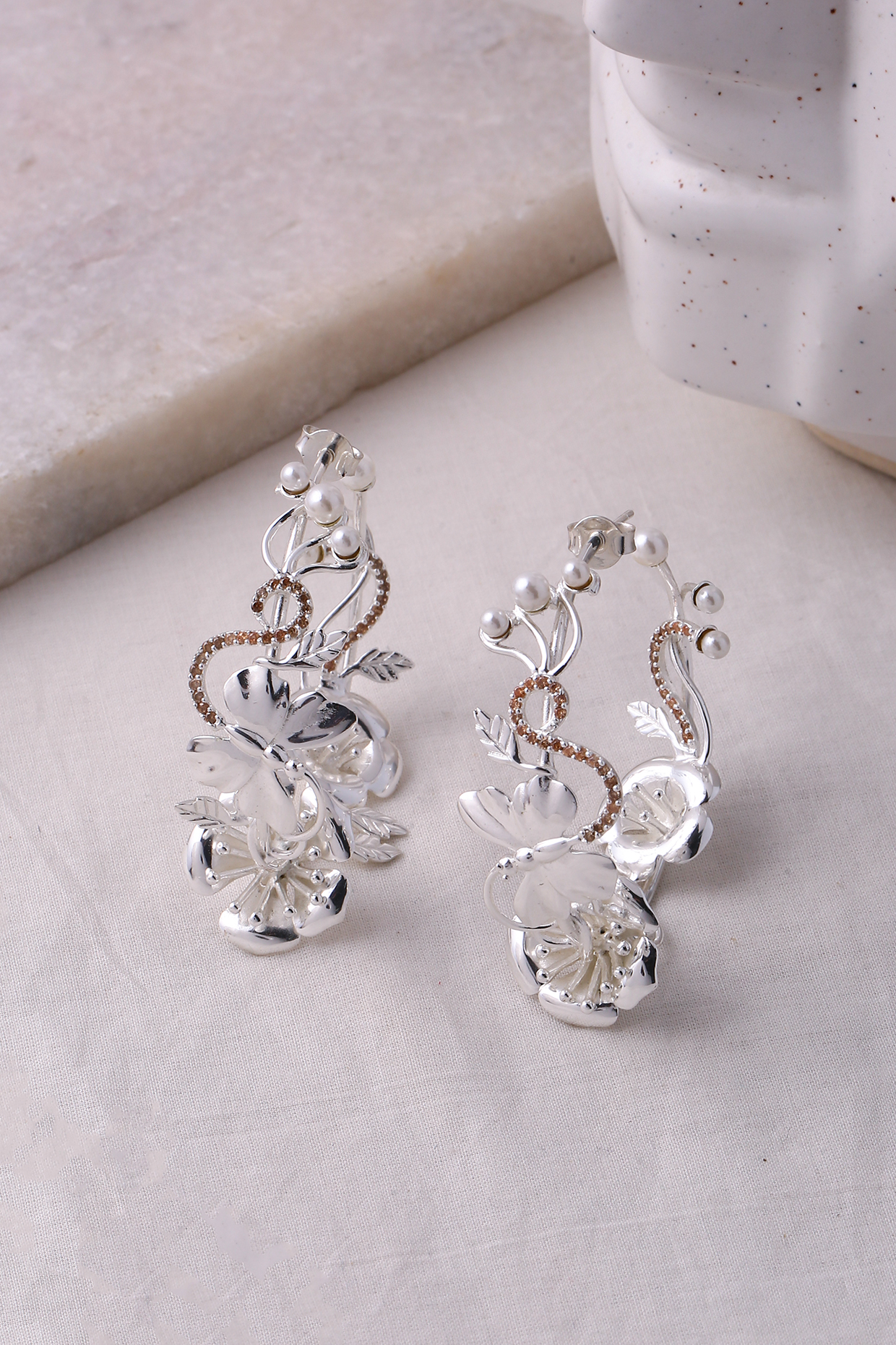 Silver Finish Pearl Hoop Earrings by Jewellery by Astha Jagwani