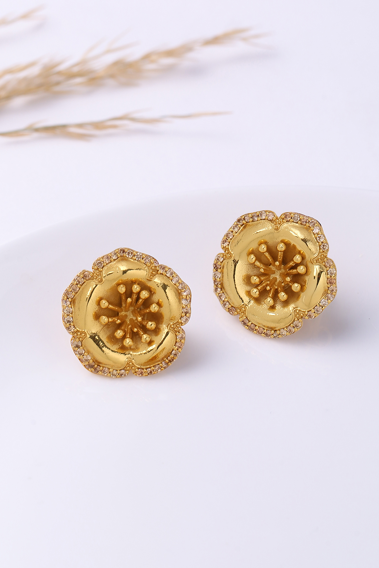 Gold Finish Stud Earrings by Jewellery by Astha Jagwani