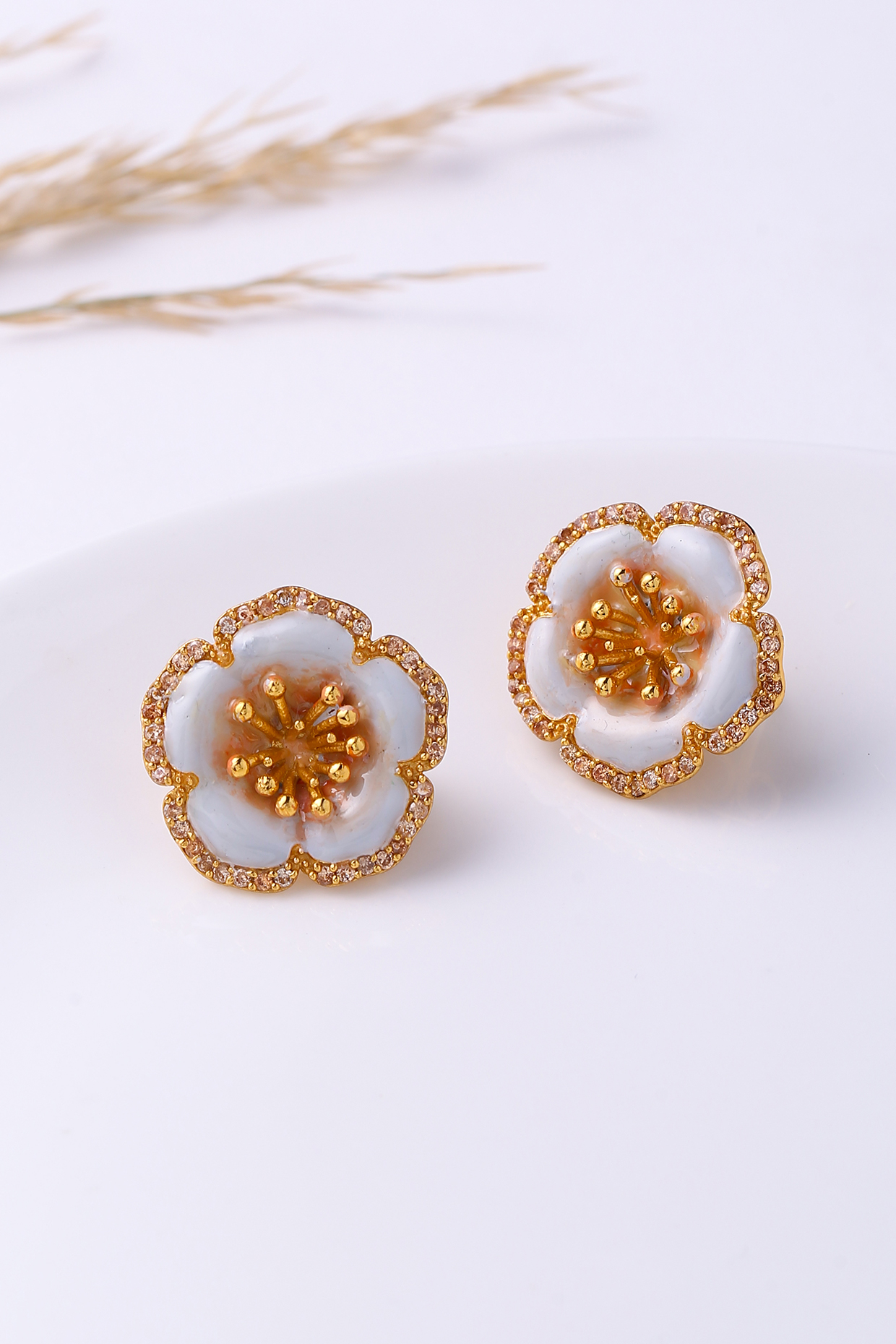 Gold Finish Grey Enameled Stud Earrings by Jewellery by Astha Jagwani