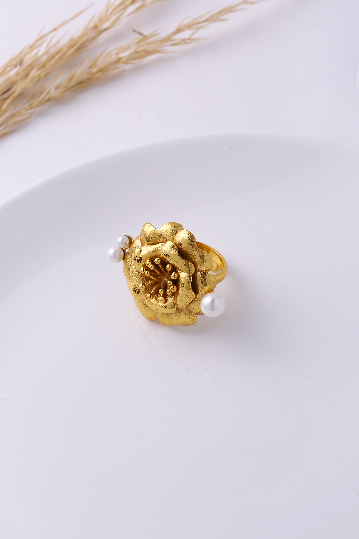 Gold Finish Pearl Floral Ring by Jewellery by Astha Jagwani