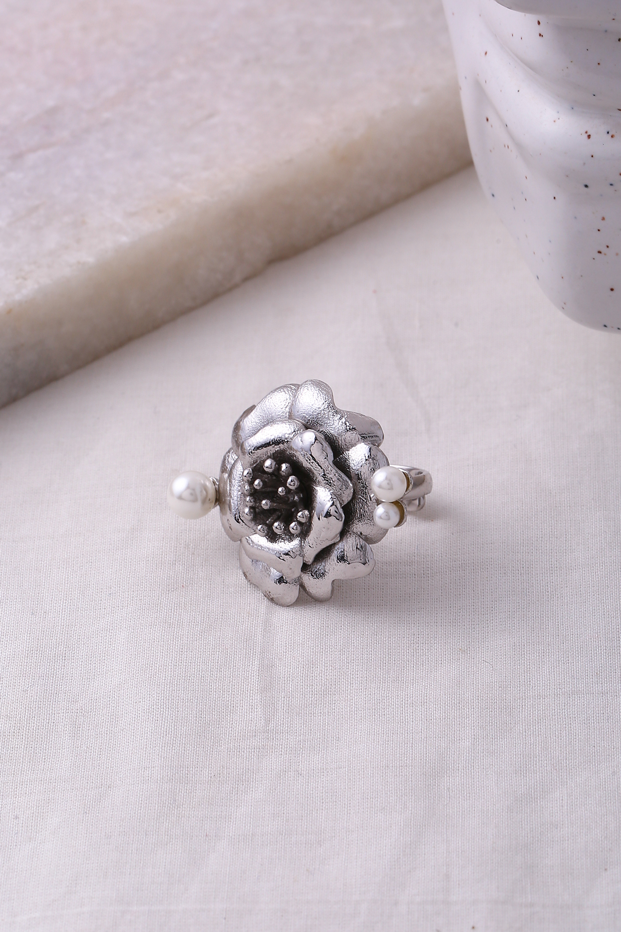 Silver Finish Pearl Floral Ring by Jewellery by Astha Jagwani