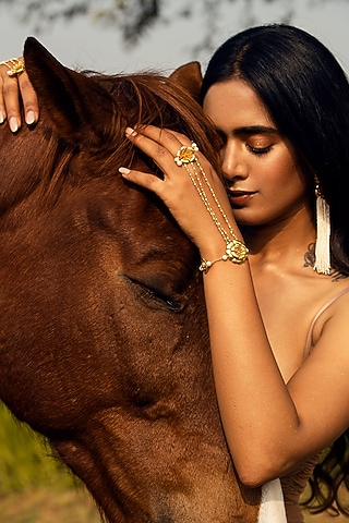 Gold Finish Pearl Floral Hand Harness by Jewellery by Astha Jagwani