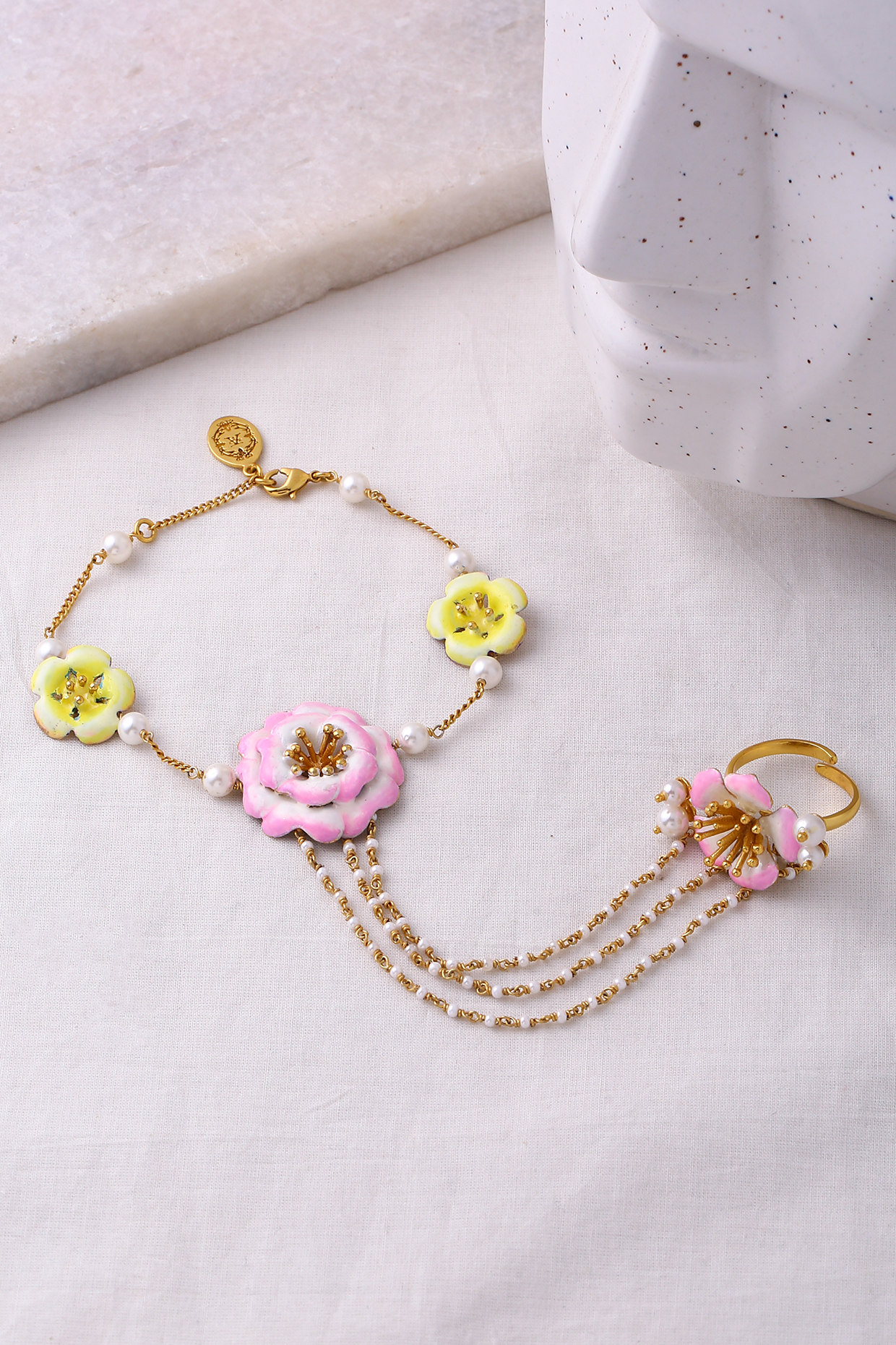 Gold Plated Pearl Floral Hand Harness by Jewellery by Astha Jagwani