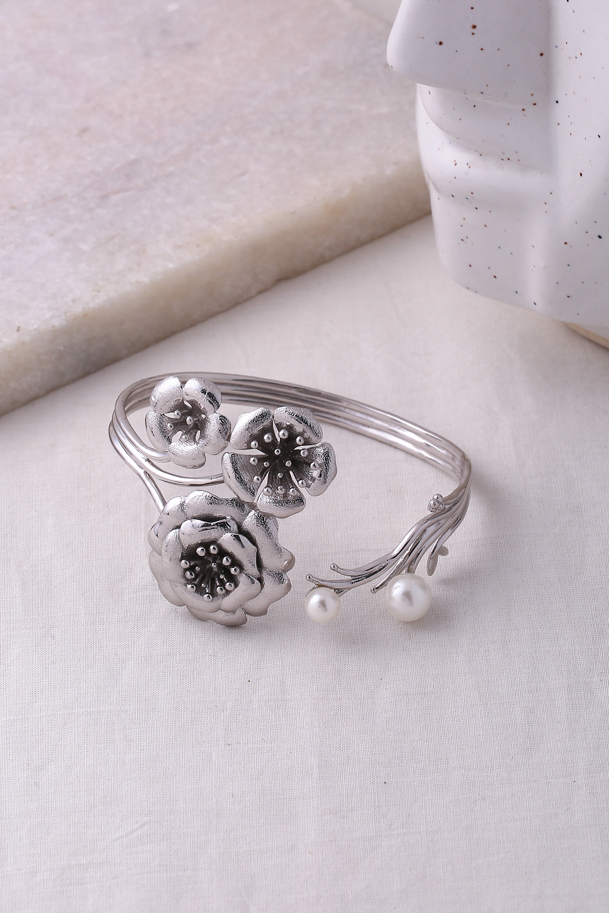 Silver Finish Periwinkle Cuff by Jewellery by Astha Jagwani