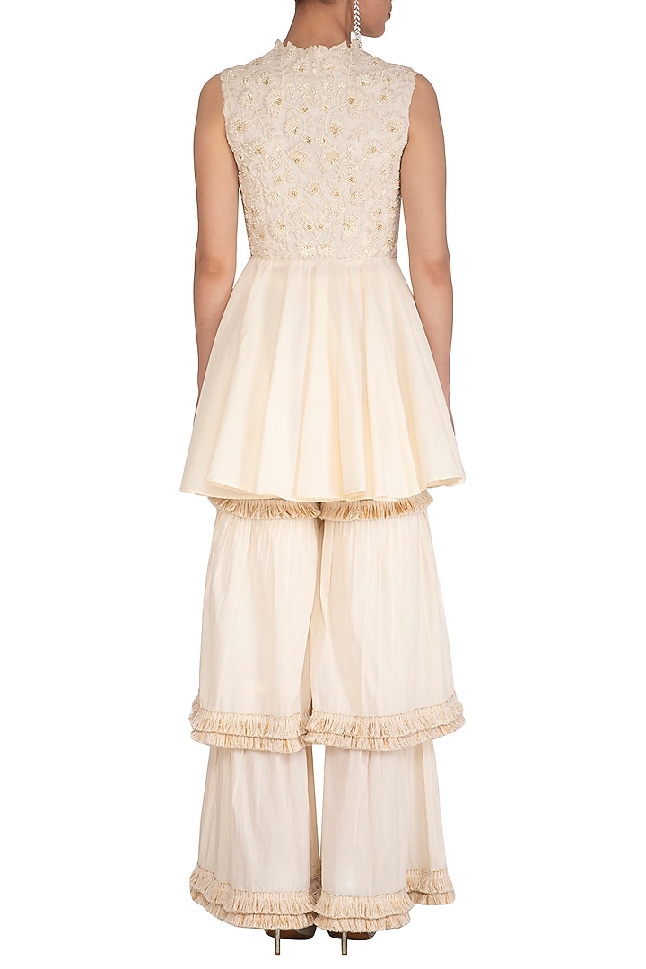 Ivory Embroidered Peplum Blouse With Wedding Sharara Pants by J by Jannat at Pernia's Pop Up Shop